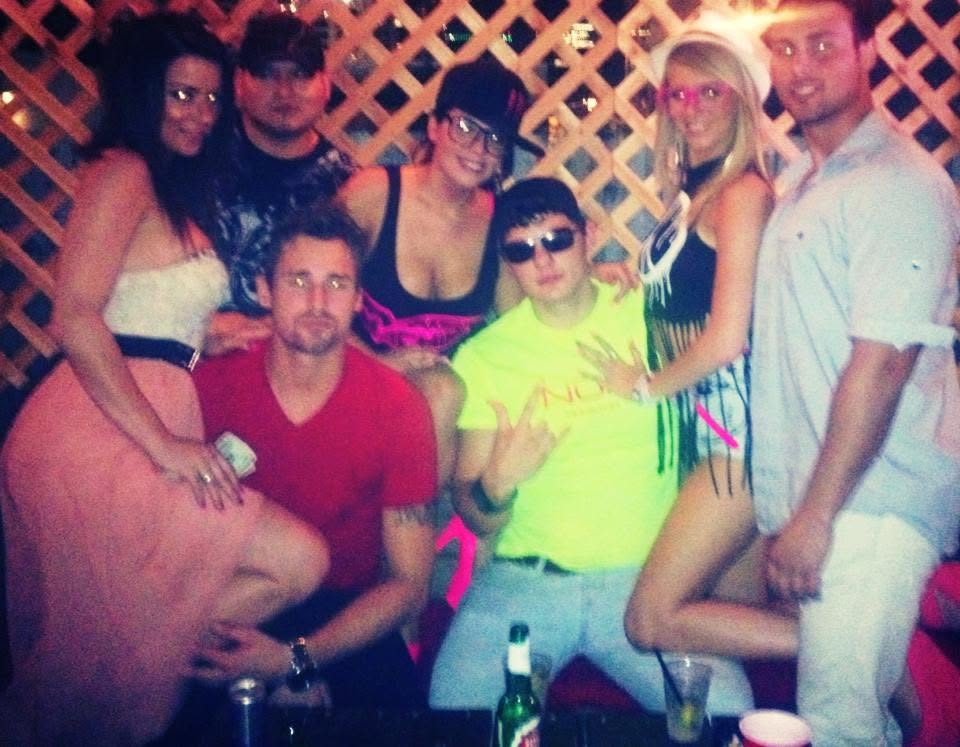 A hazy nightlife group portrait at Capitol