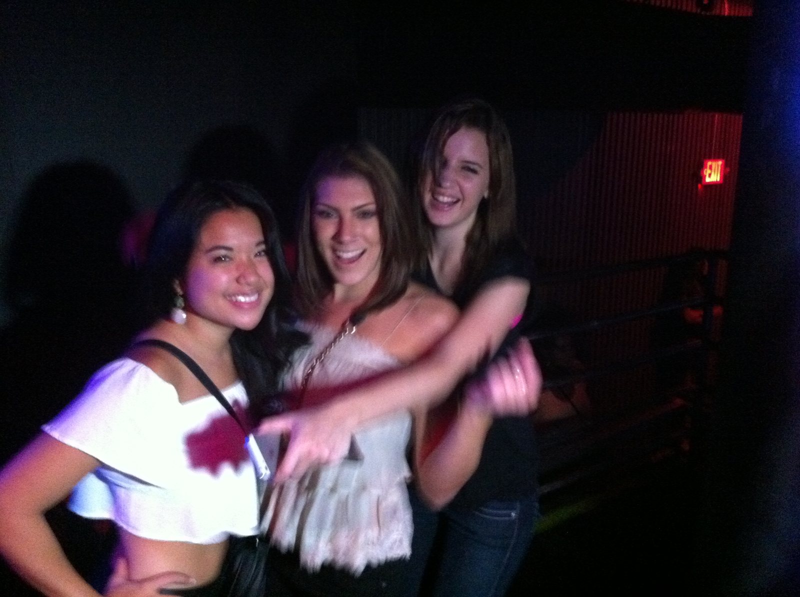 Friends posing together on a patterned dance floor