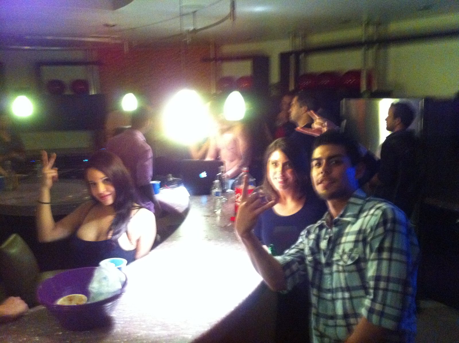 Friends caught by the flash inside a busy room