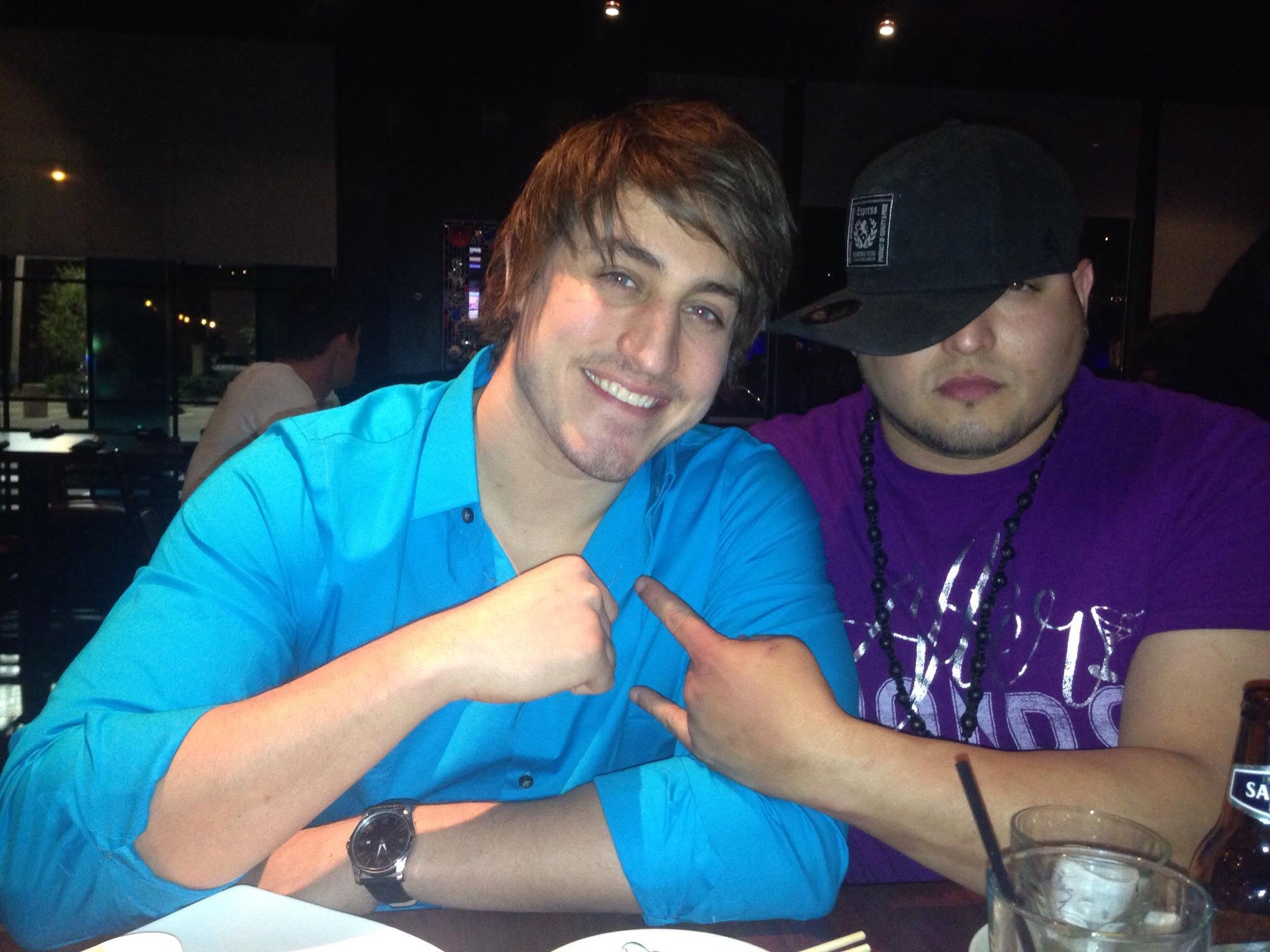 Cixx and a friend at a table during a night out