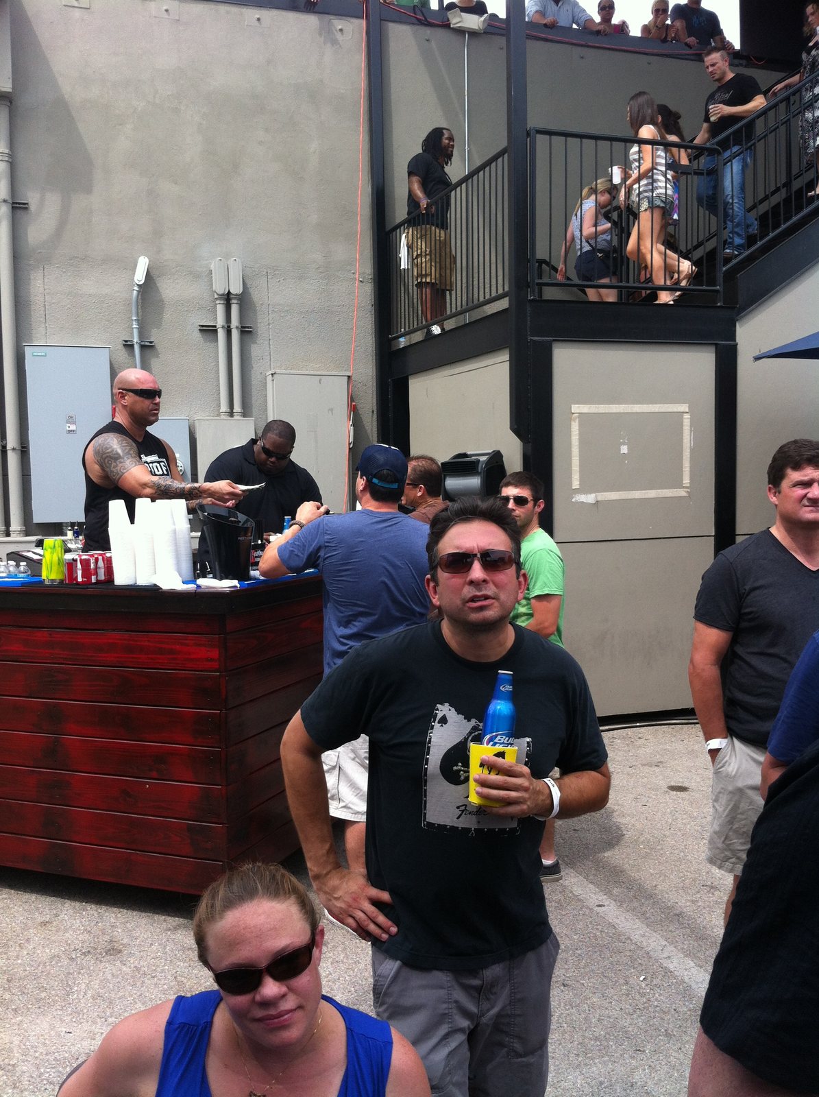 Friends posing outside a crowded event