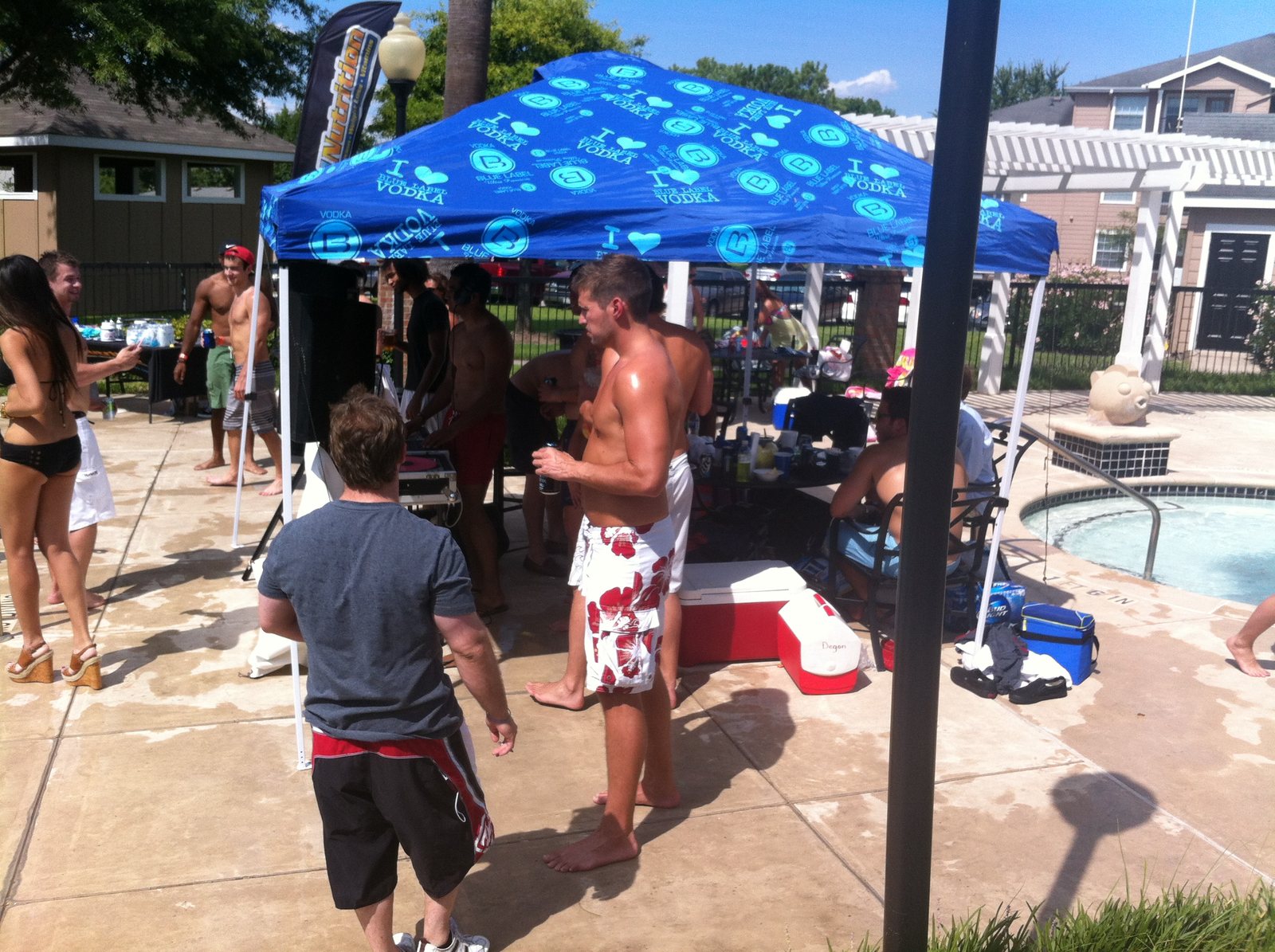 A lively pool deck with music and guests