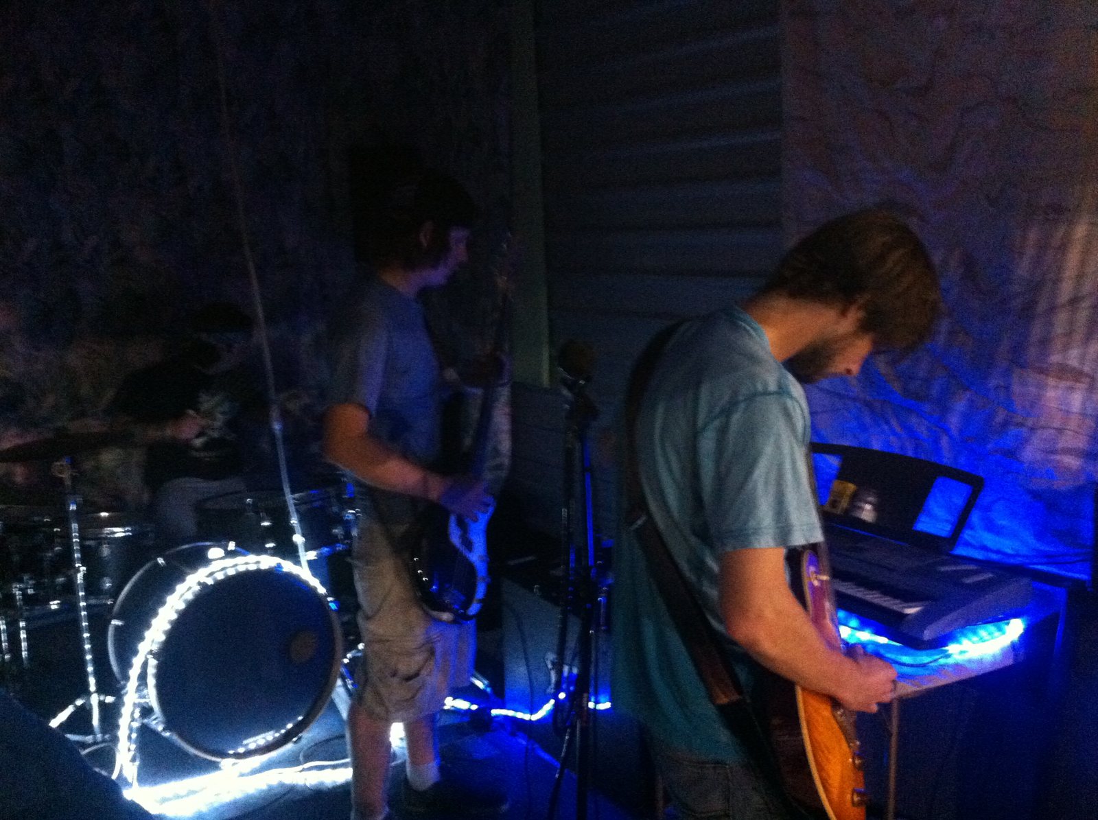 Drums and guitar moving together during a live set